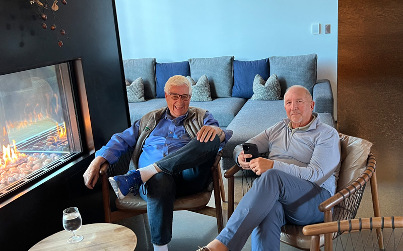 John Addink, co-founder of A-G Sod Farms (left) seated with Larry LeMay (right), current A-G Sod president and 2026 president of TPI.