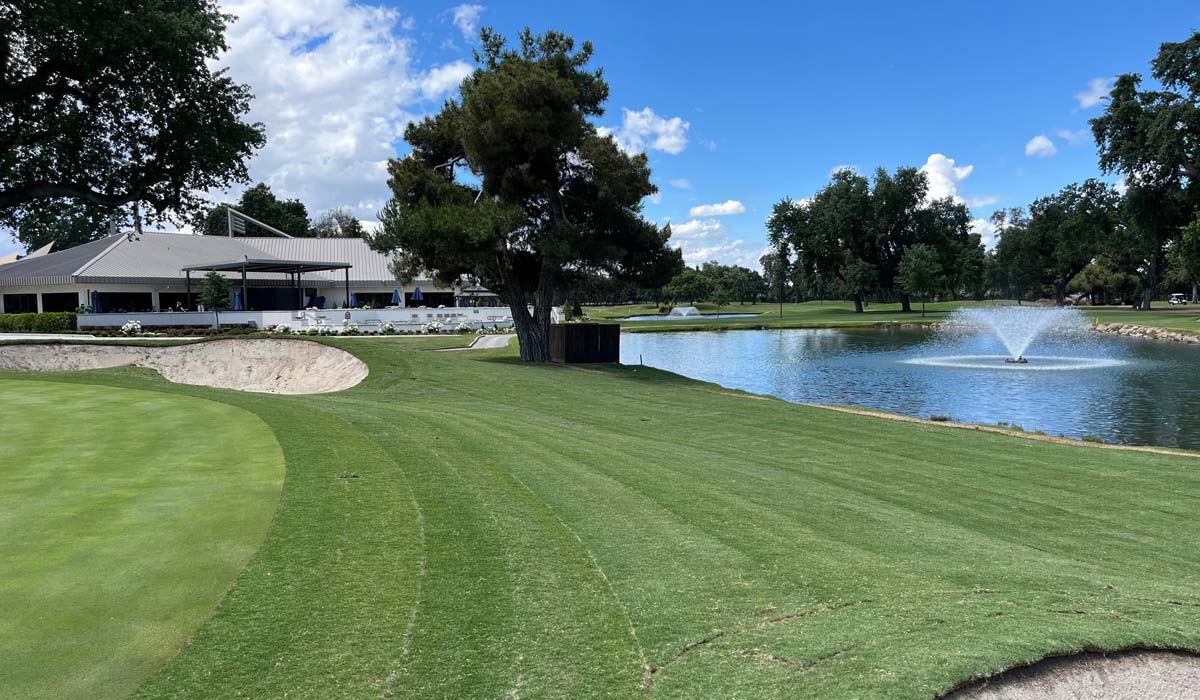Golf course water feature surrounded by natural grass at Visalia Country Club, CA.